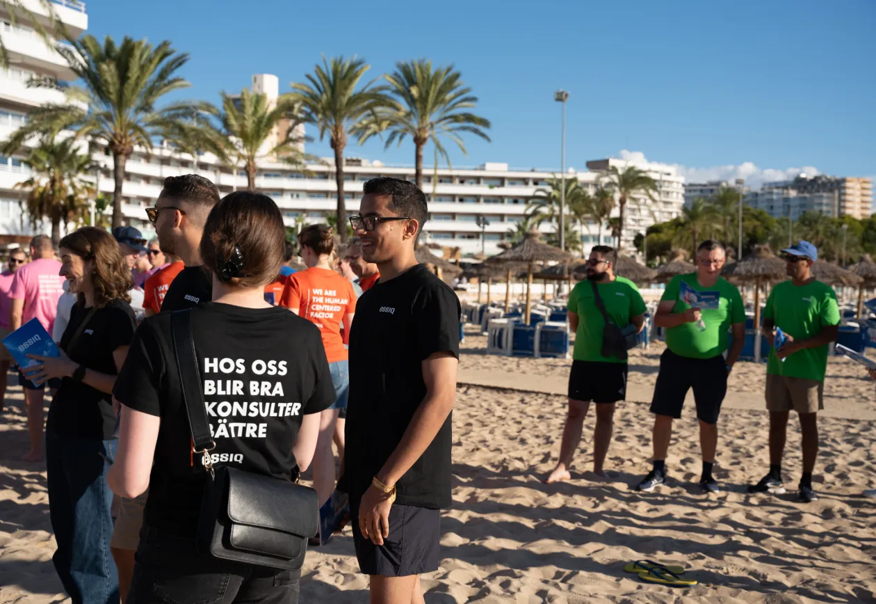 ESSIQ colleagues on a beach during a conference trip in Spain